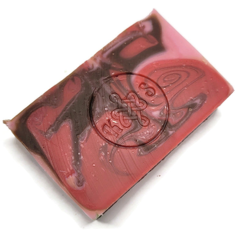 Red and brown soap bar with a logo on a white background